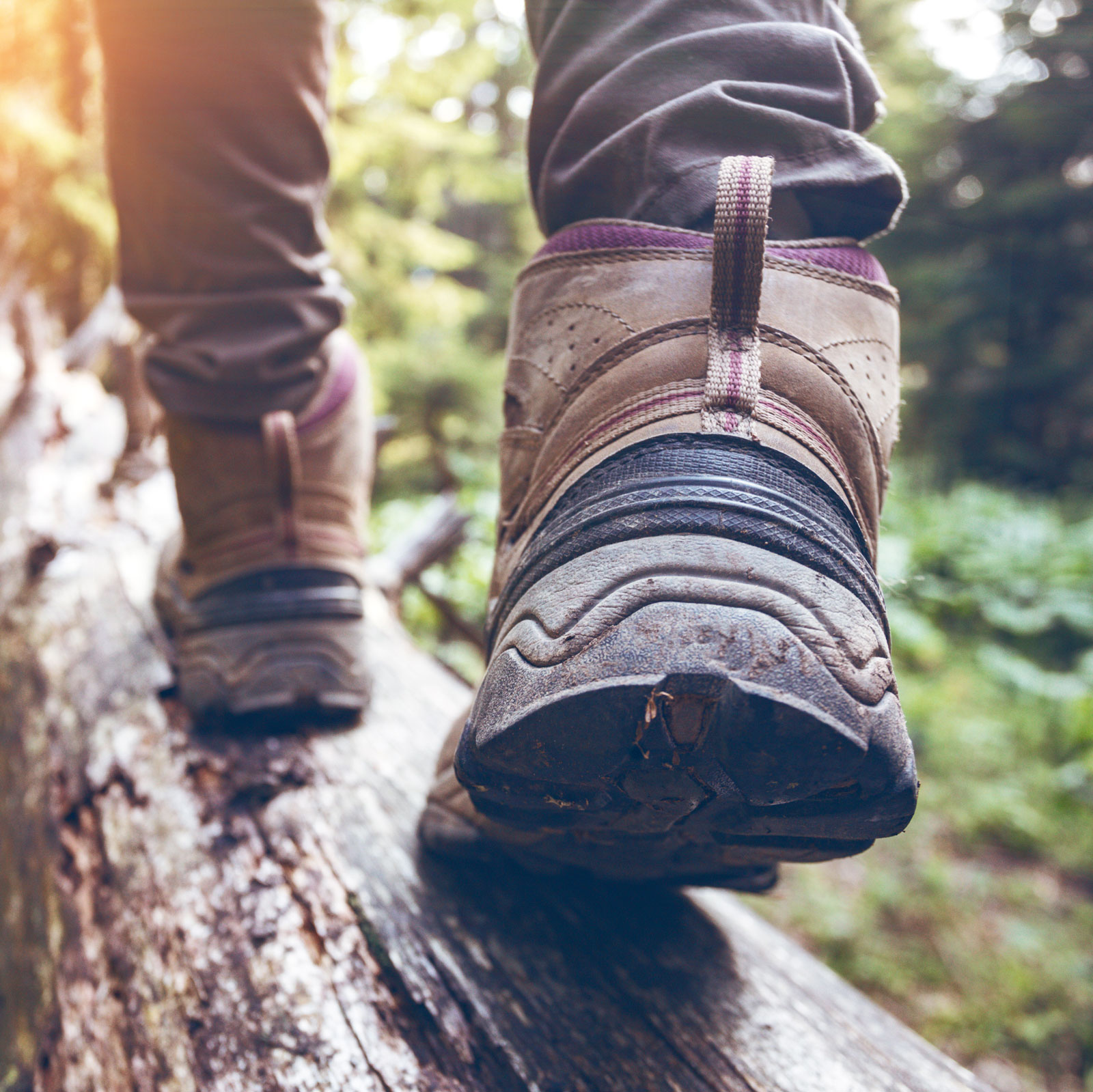 Hiking boots - walking on a log
